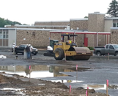 construction vehicle at school parking lot