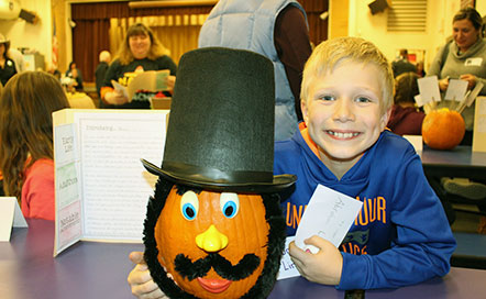 Student displays Abraham Lincoln pumpkin