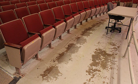 auditorium floor worn away