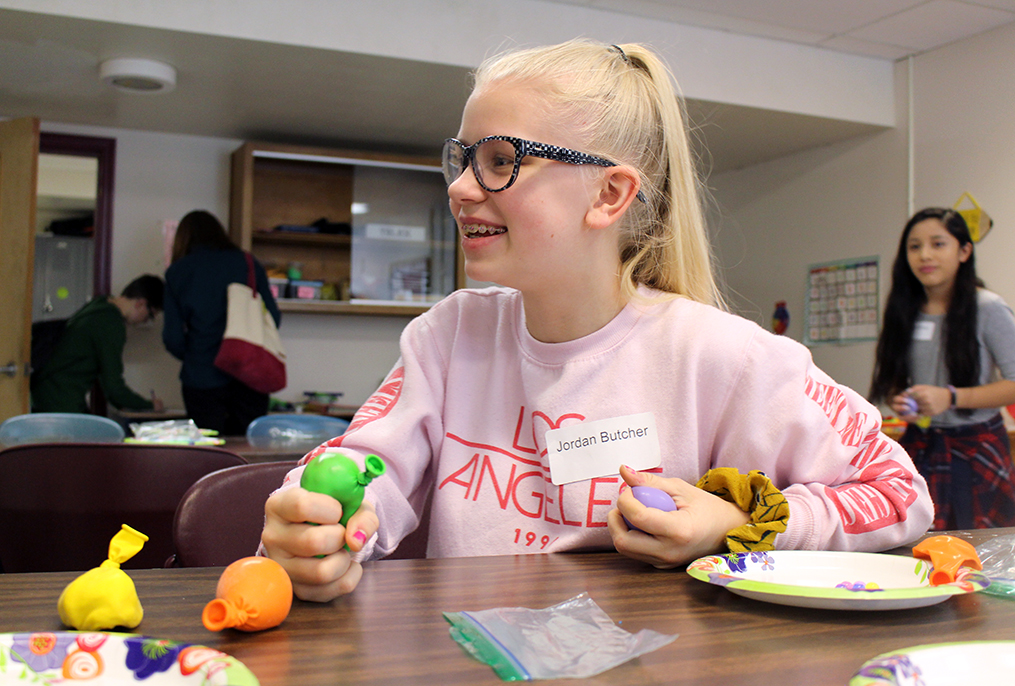 student squeezing homemade stress relief ball