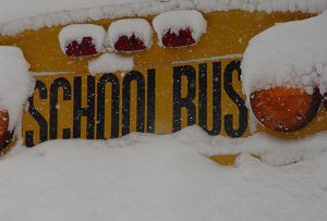 school bus and lights covered in snow
