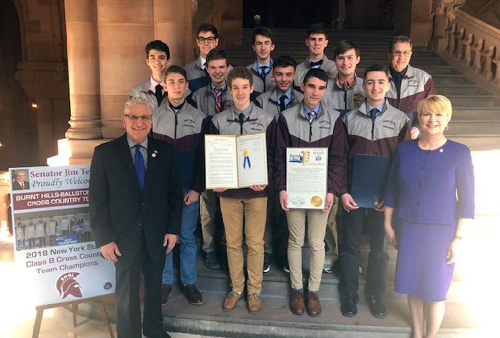 Senator Tedisco, Assemblywoman Walsh, Coach Button and boys cross country team on steps at NYS Capitol