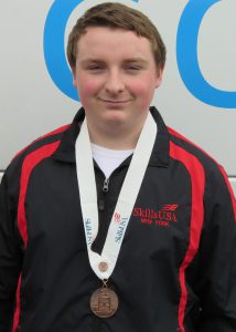 student with winning medal around his neck
