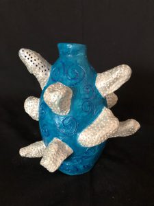 teal and white sculpture