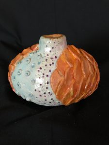 orange and white round vase