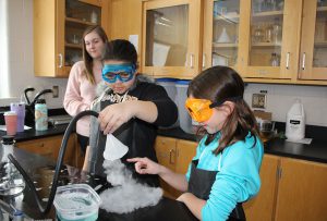 two students with dry ice bubbles