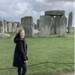 student standing near Stonehenge