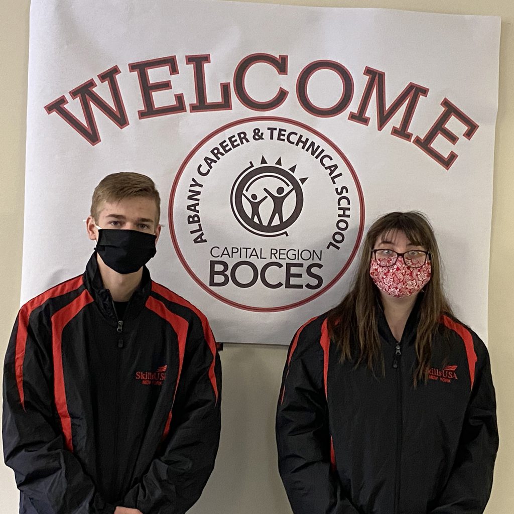 students standing near sign