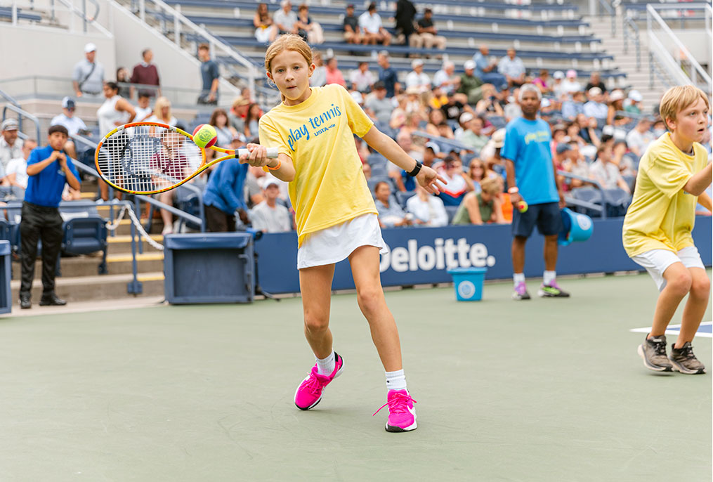 A tennis player hitting a ball.