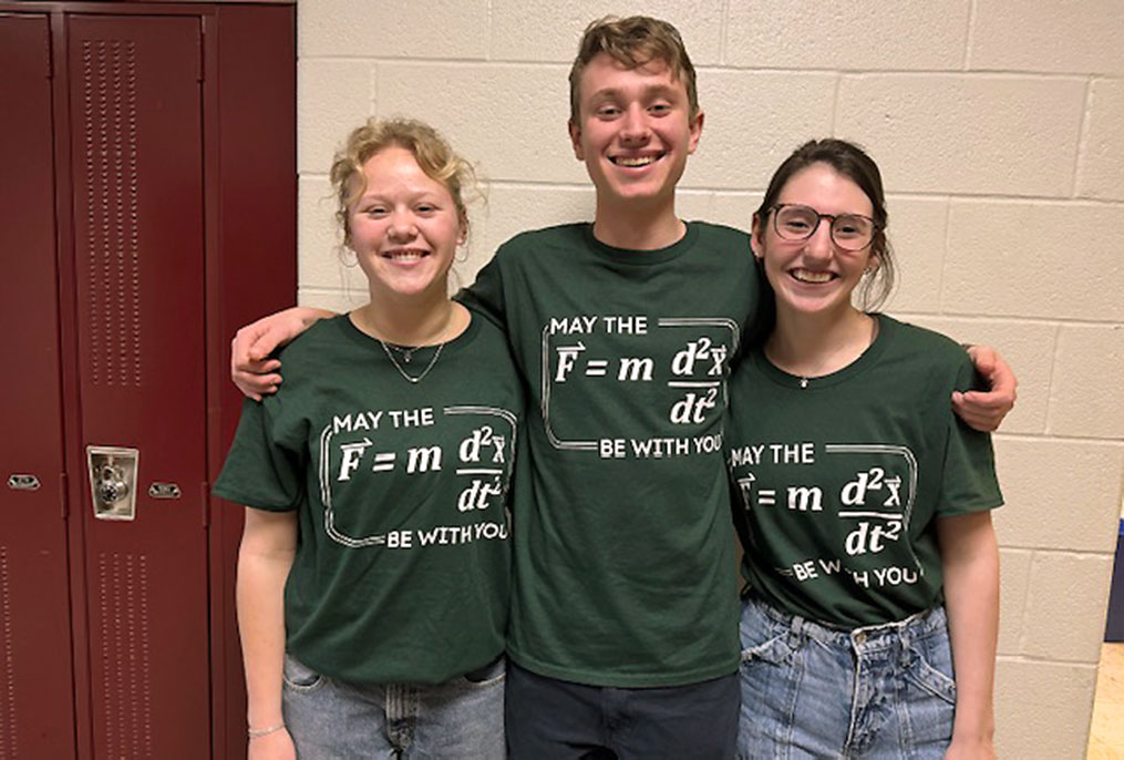 BHBL High School Science Research Students wearing the formula for force on their shirts.