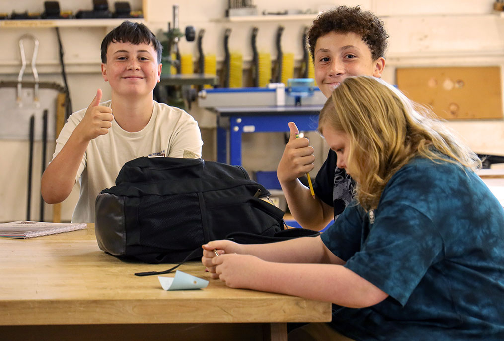 Middle School students giving the thumbs up on the first day of school.