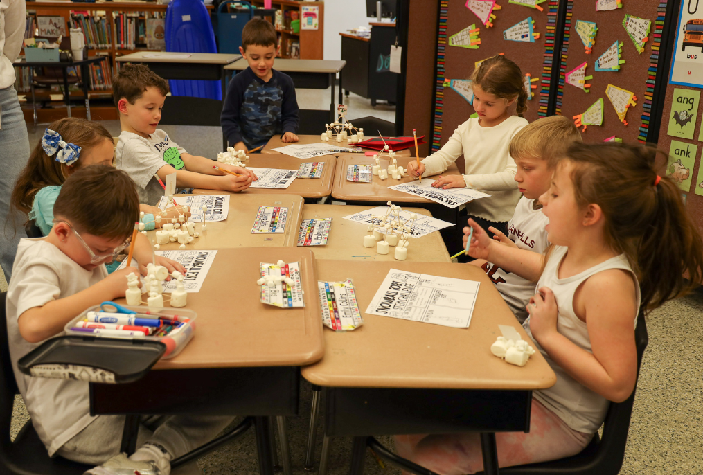 Students working at their desks on a STEM project