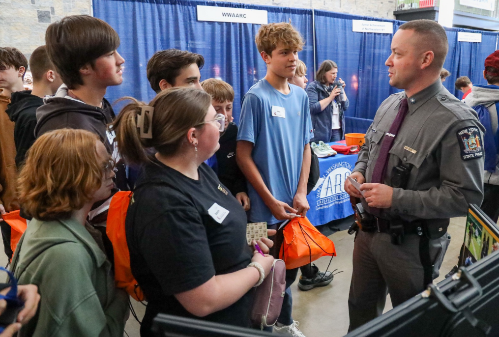 BHBL Web Slider (5) Middle school students talking to a state trooper at Career Jam